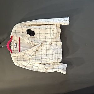 Karl Lagerfeld spring blazer with short fringe along sleeve and blazer edges.